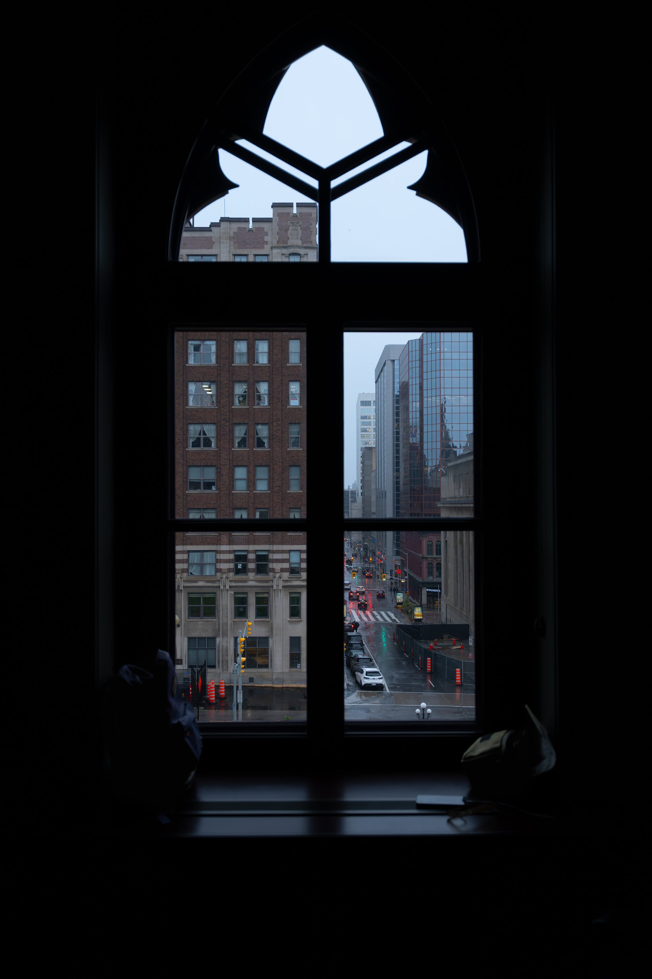 Parliament’s Gothic architecture framed by a dark window