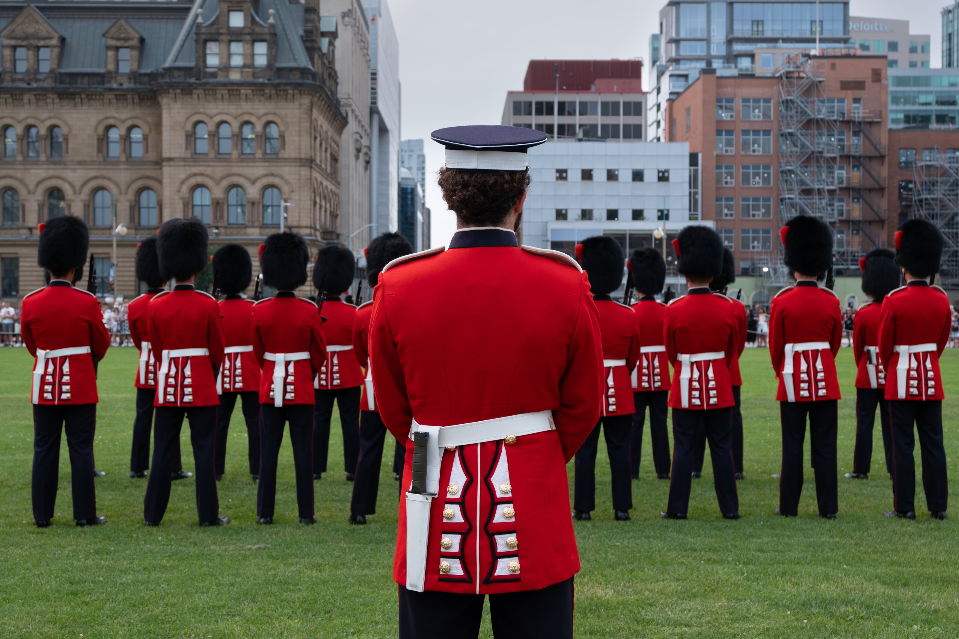 Ceremonial guards in scarlet uniforms on Parliament Hill