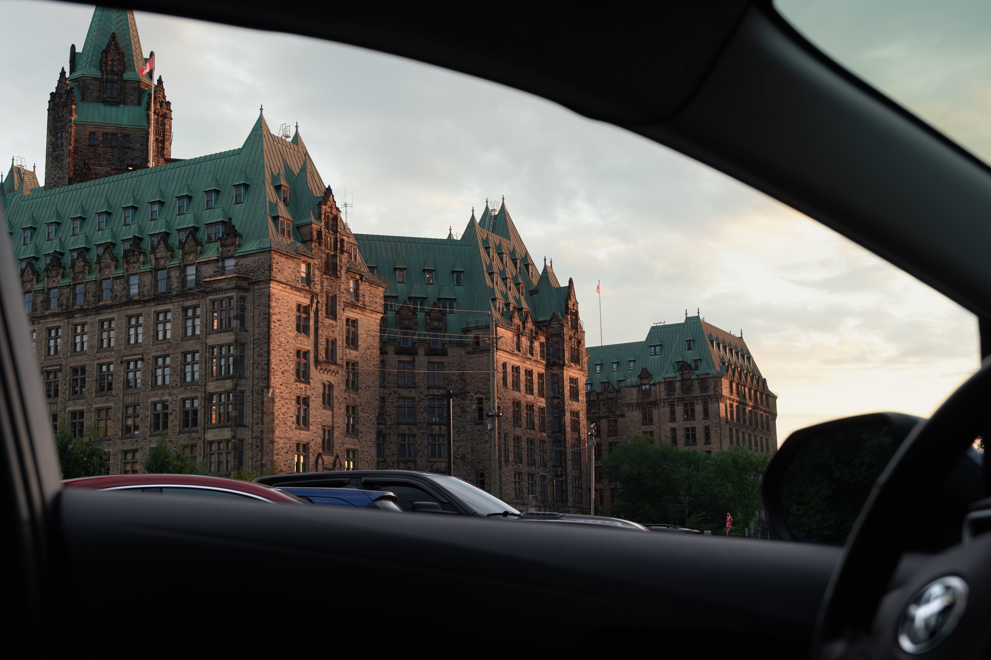 Parliament buildings seen through a car window at sunset