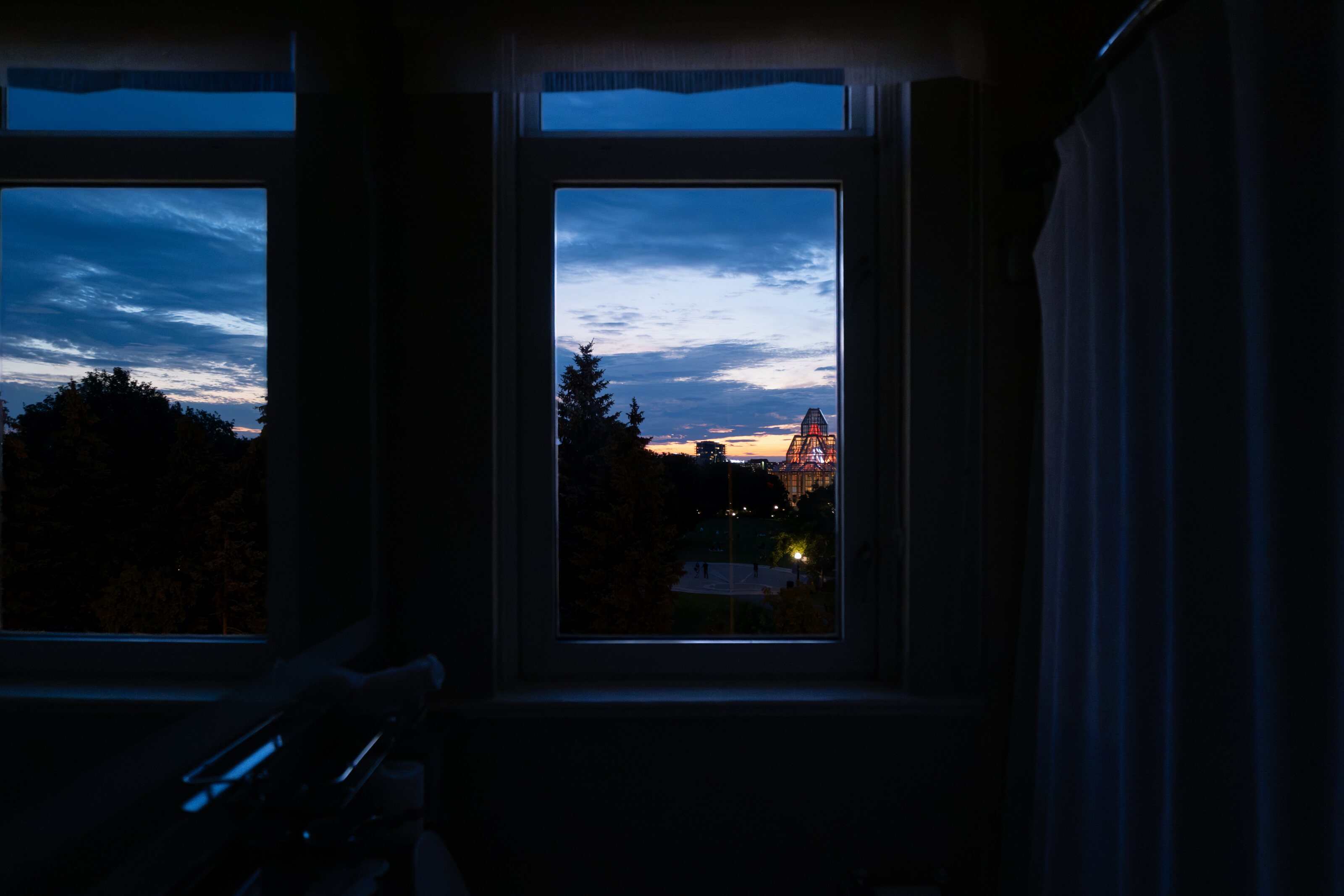 Parliament visible through dark windows at blue hour